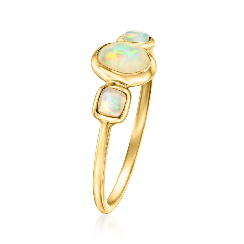 Three-stone opal ring in 14kt yellow gold, oval center with two small square opals