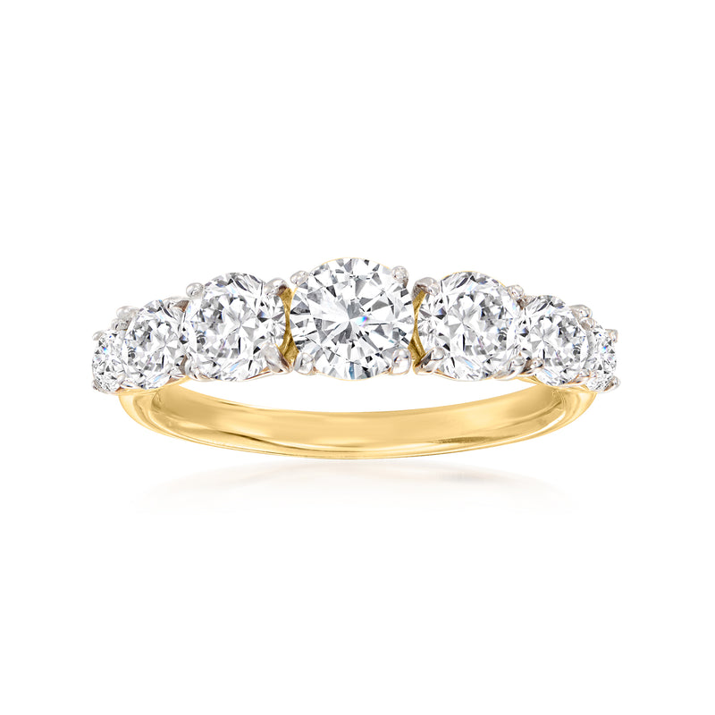 Graduated seven-stone diamond ring in 14k yellow gold, polished band and round stones