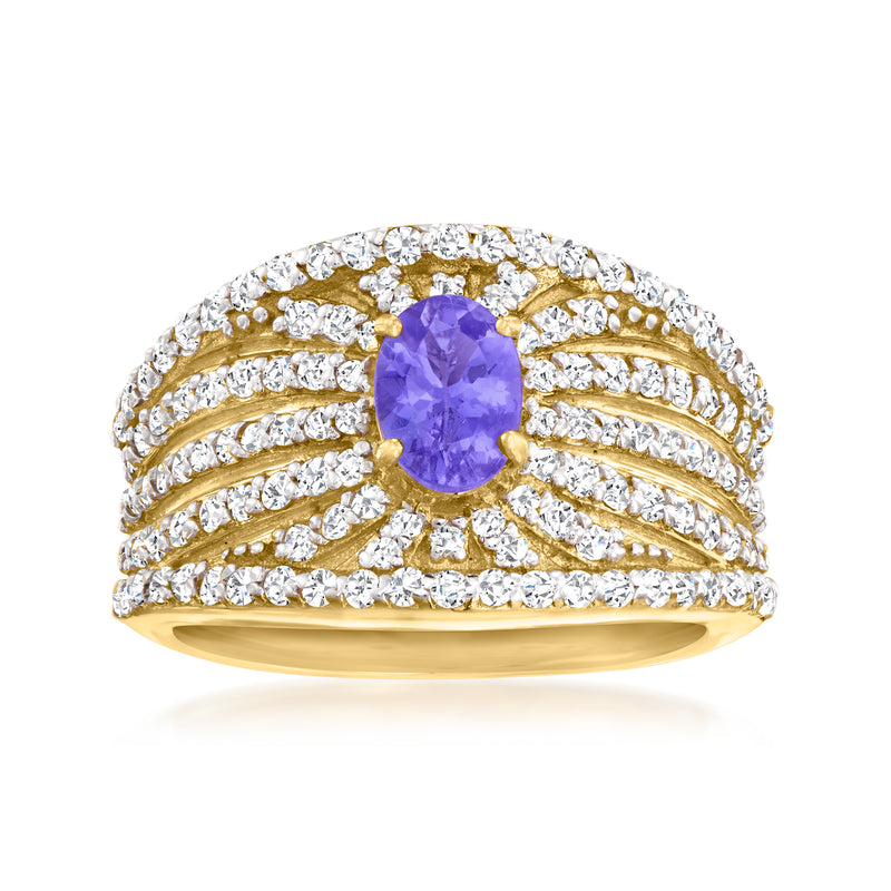 Gold-tone ring with oval purple center stone and clear round stones halo
