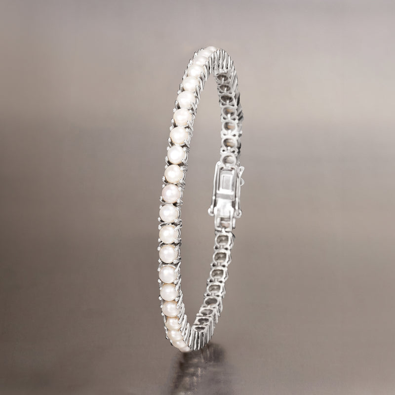 Sterling silver tennis bracelet side view with white cultured pearls and box clasp