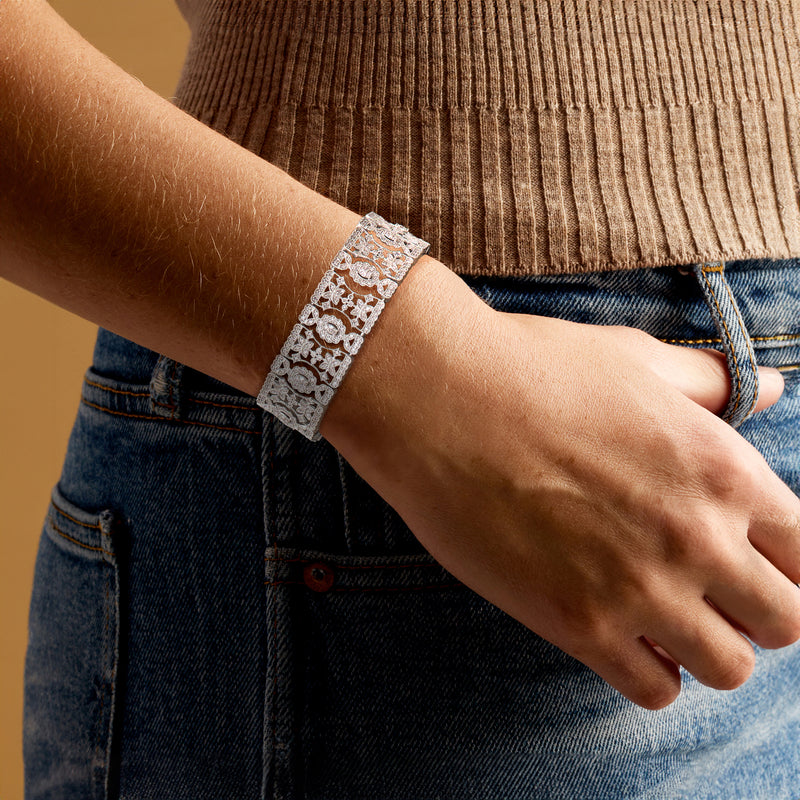 Sterling silver diamond floral bracelet on a wrist