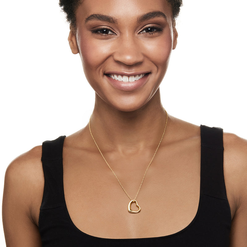 14kt yellow gold heart pendant necklace on a model, open heart charm