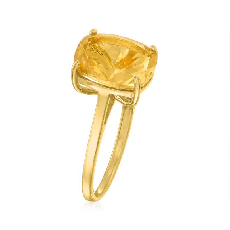 Side view of oval yellow citrine ring with gold-tone band and four prongs