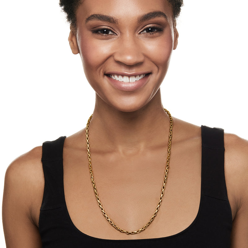 Yellow gold square-link necklace worn on model's neck