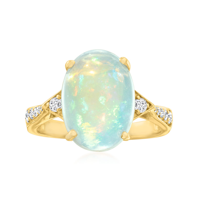 Oval opal cabochon ring with diamond side stones in 14k yellow gold setting