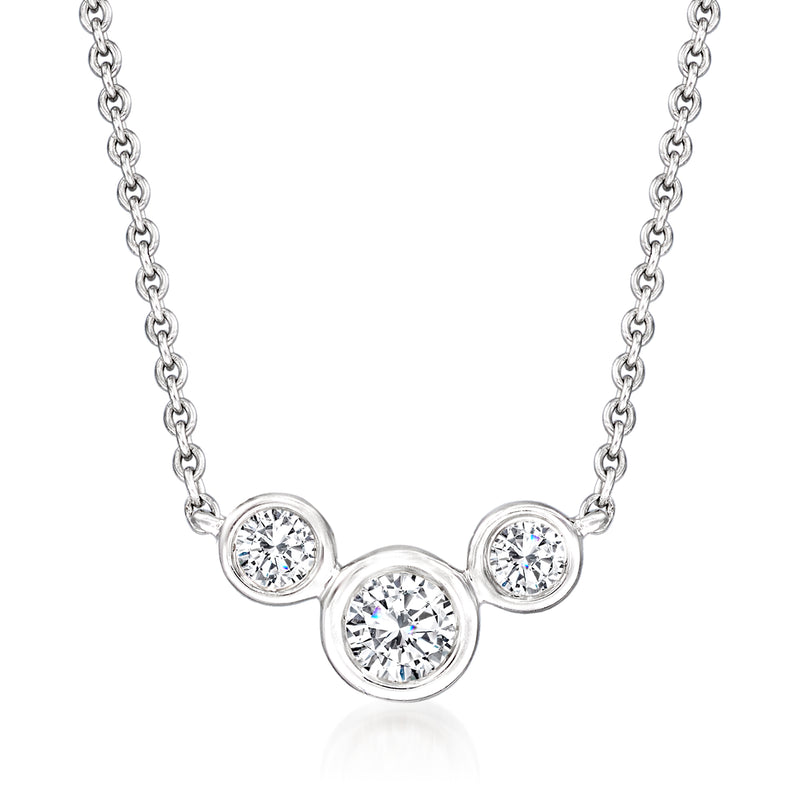 Sterling silver bezel-set diamond necklace with three round diamond accents on chain