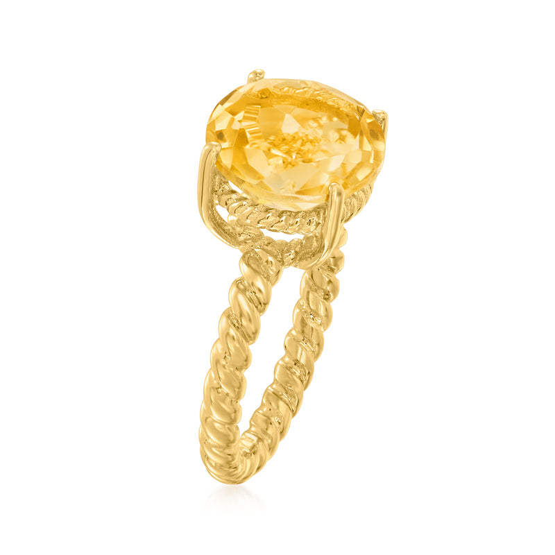 Gold ring with round yellow citrine on twisted rope-style band, side view