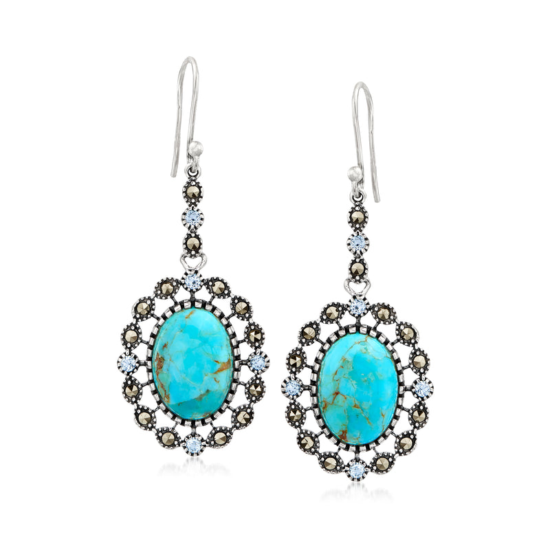 Sterling silver drop earrings with oval turquoise center and blue stone halo, earwire