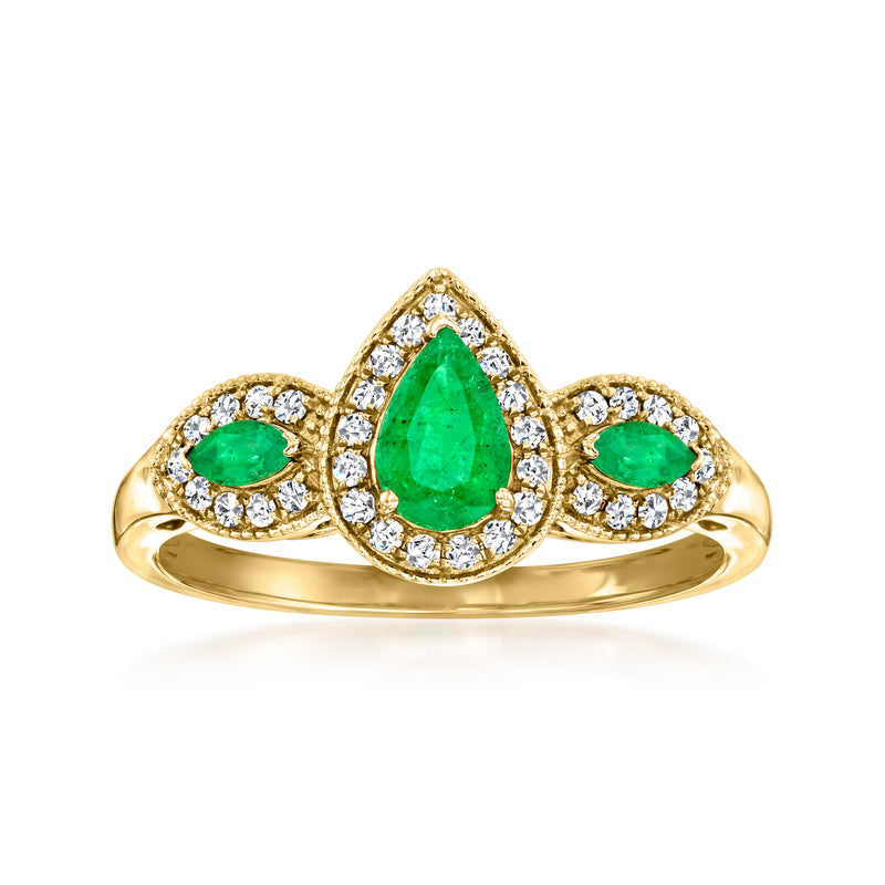 14kt yellow gold ring with oval green emerald and diamond halo side stones