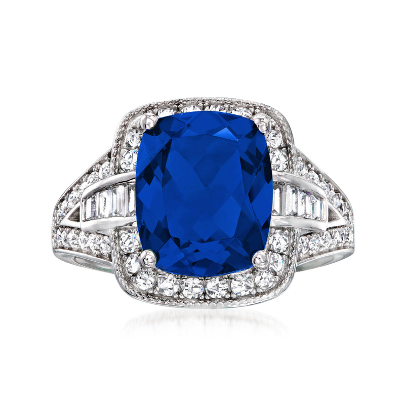 Sterling silver ring with large oval blue stone and side CZ baguettes