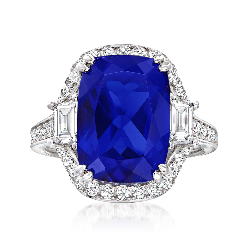 Sterling silver ring with large blue cushion-cut simulated sapphire and CZ halo, side baguettes