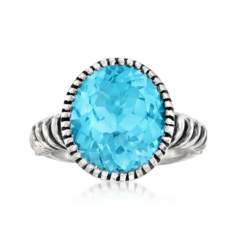 Sterling silver twist ring with large sky-blue topaz round center and diamond accents