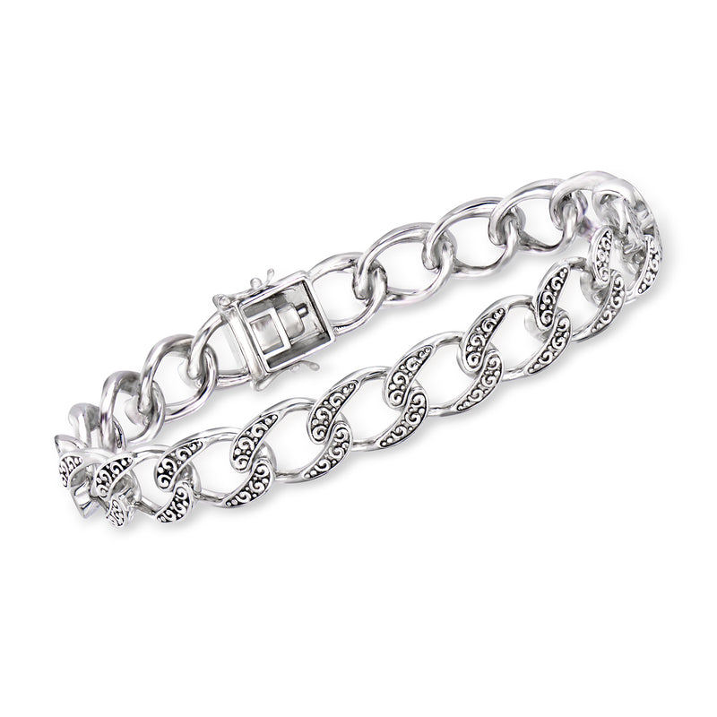 Sterling silver Cuban-link bracelet with oval scroll inlays and box clasp