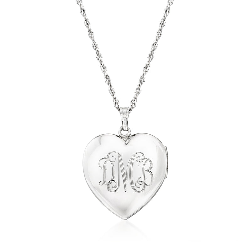 Sterling silver heart locket with engraved monogram initials on hinged front