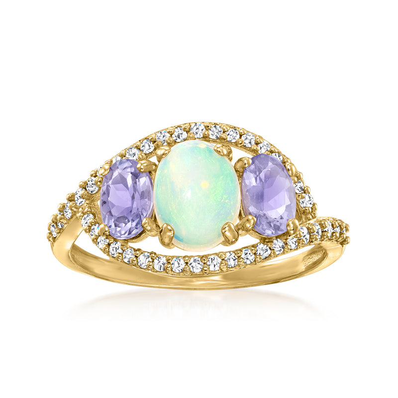 14kt yellow gold ring with oval opal center, diamond halo, and purple gemstones