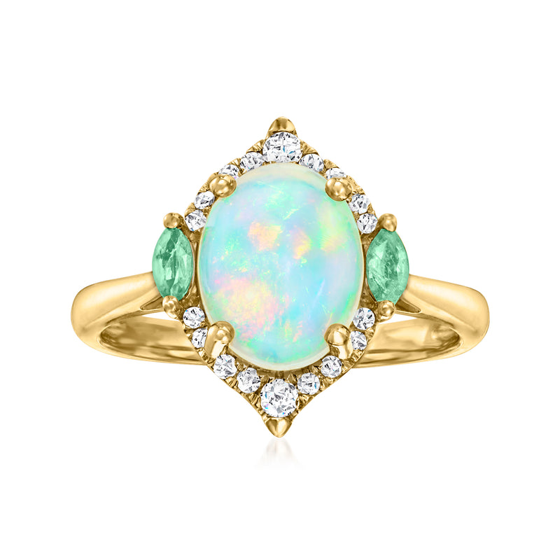 14kt yellow gold ring with oval Ethiopian opal, diamond halo, and green emerald side stones