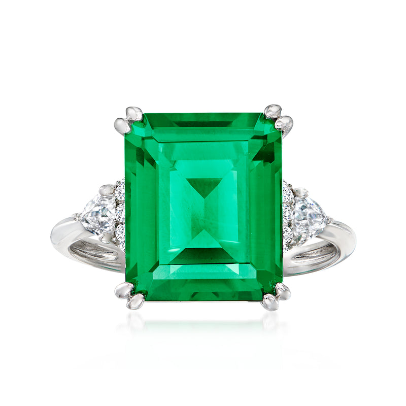 Sterling silver ring with large green emerald-cut center and four prongs, CZ halo