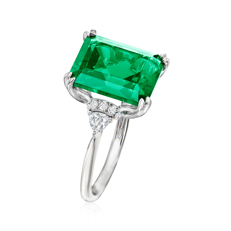 Sterling silver ring with emerald-cut green center stone and sparkle CZ side accents