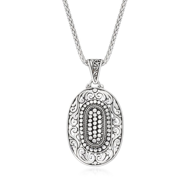 Sterling silver oval scrollwork pendant necklace with engraved oval center and chain