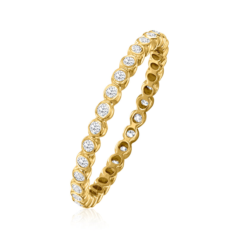 Yellow gold bezel-set diamond eternity band, angled side view