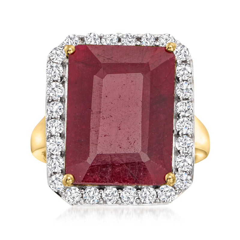 Ruby red cushion-cut gemstone ring with white stone halo and 18kt yellow gold setting