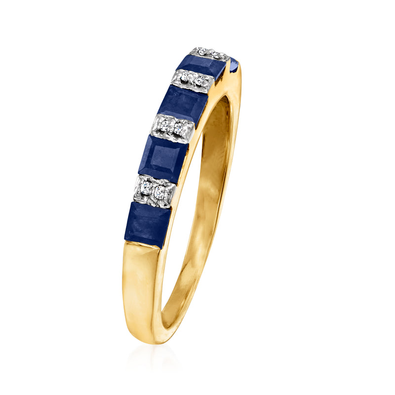 Gold sapphire ring with dark blue channel sections and round diamond accents