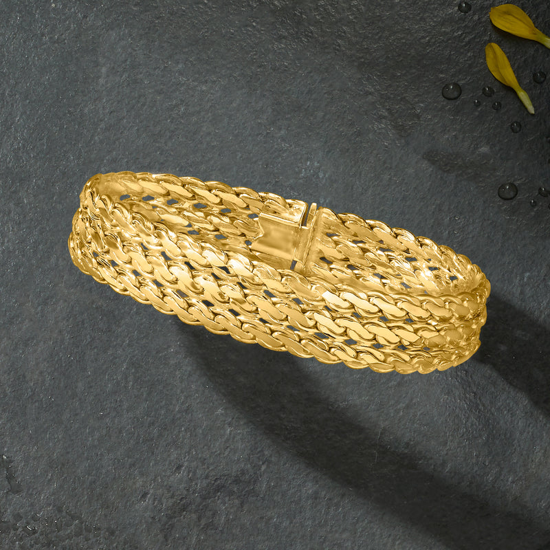 Yellow gold three-row serpentine-link bracelet, angled view with box clasp.