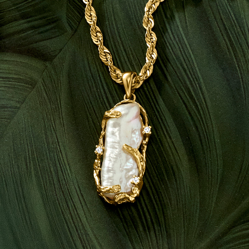 Baroque pearl pendant in 14kt yellow gold with diamond side accents on chain