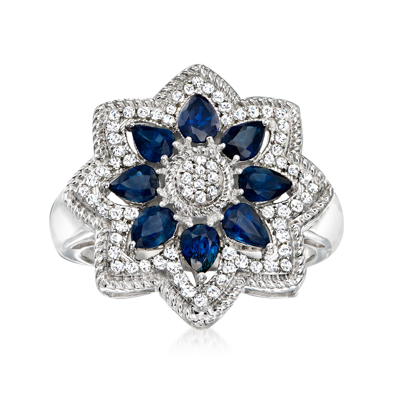 14kt white gold flower ring with blue oval sapphire center and diamond halo