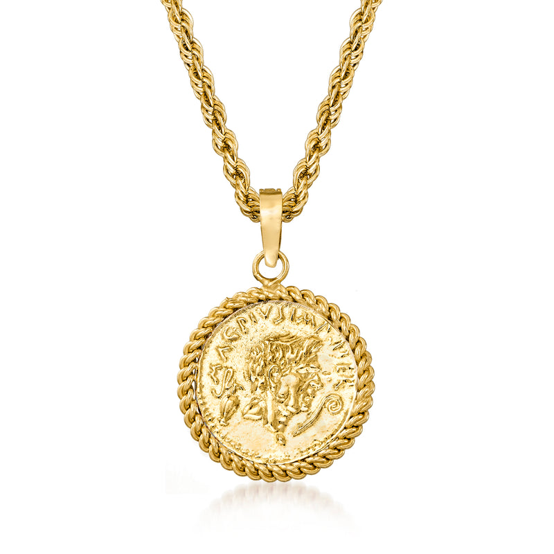 Gold-tone coin pendant necklace with ornate edge, close-up of round medallion