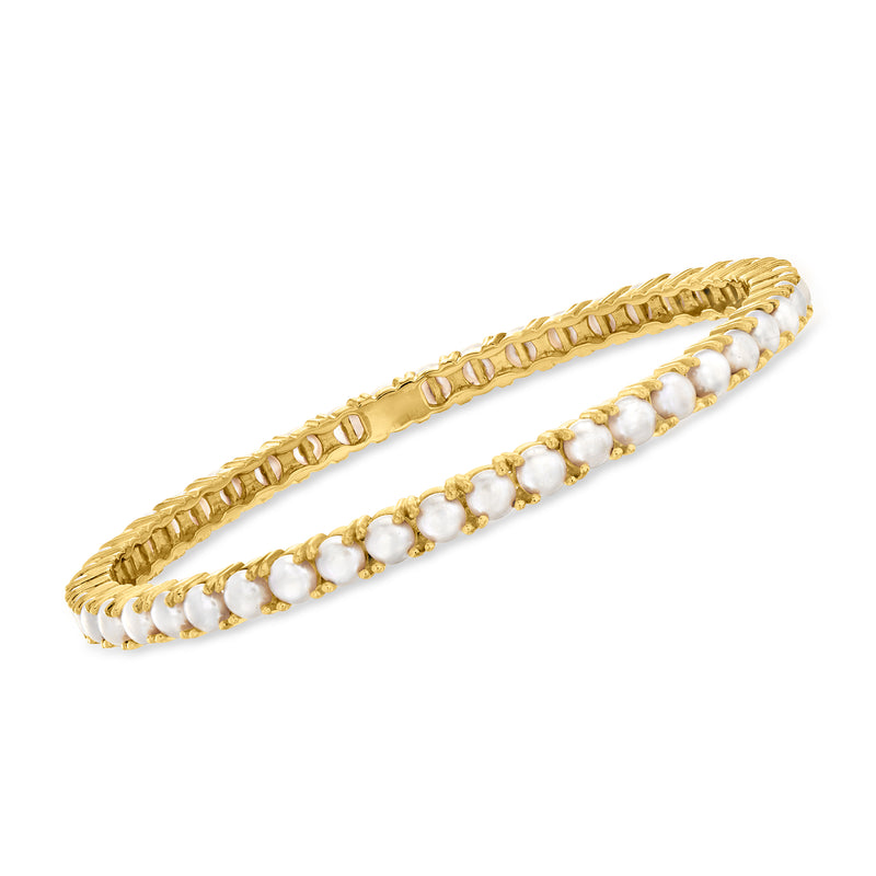 Gold bangle bracelet with rope border and white cultured pearl rows