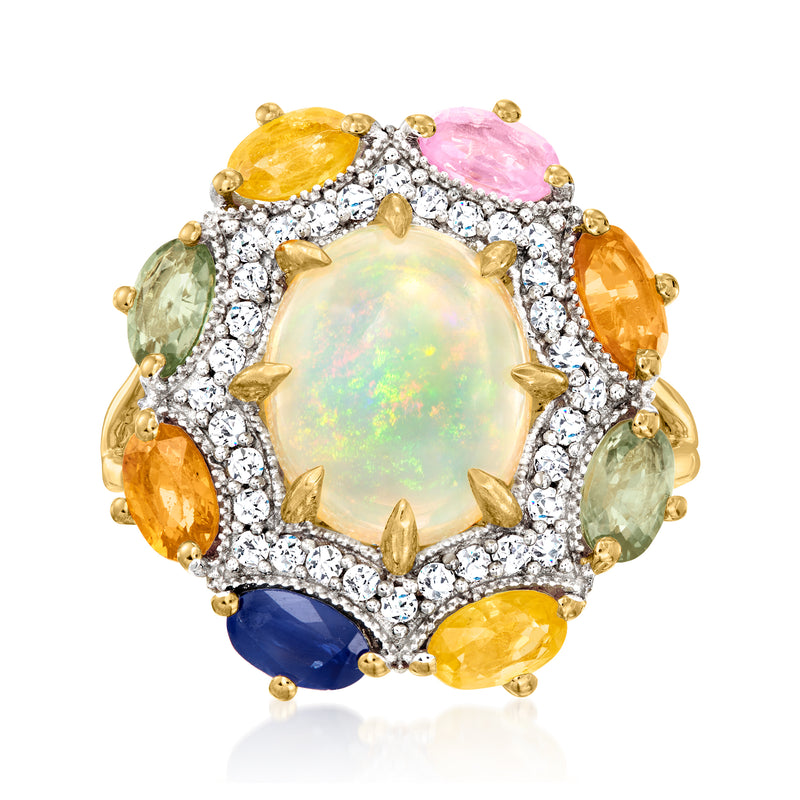 Multicolored gemstone ring with oval opal center, white zircon halo, gold prong setting.