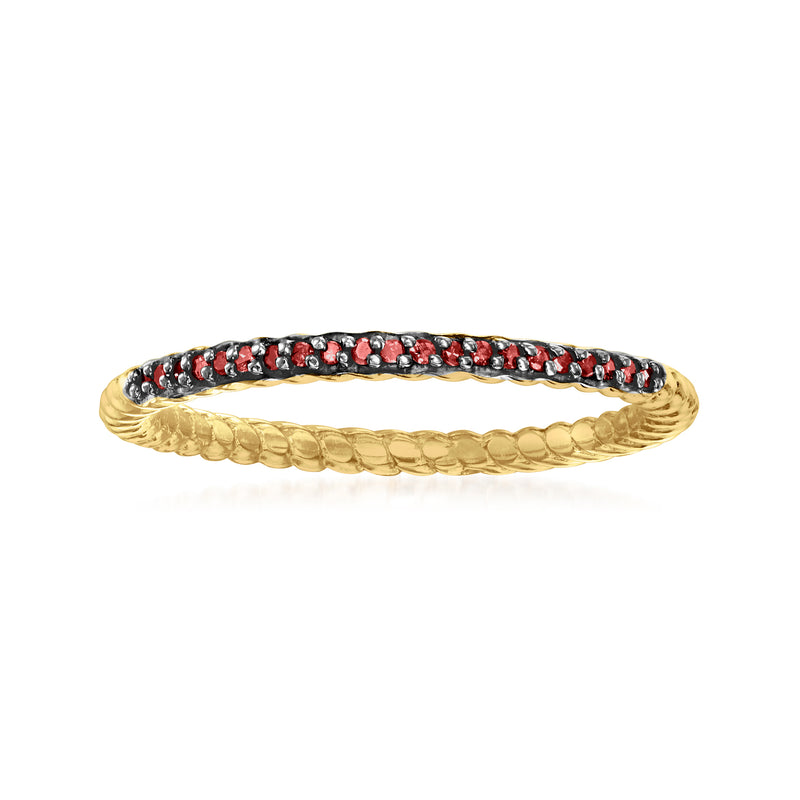 Gold over sterling ring with red diamond accents in a black bezel