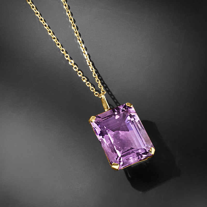 Purple amethyst pendant necklace close-up in 14kt yellow gold with faceted stone