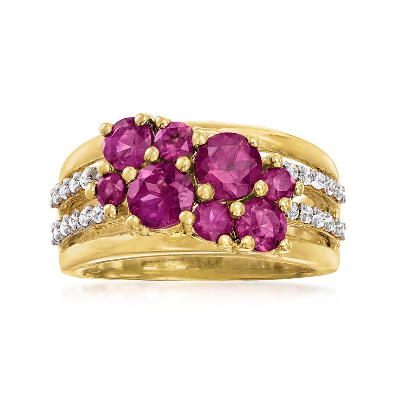 Gold ring with three faceted rhodolite garnet stones and white zircon accents