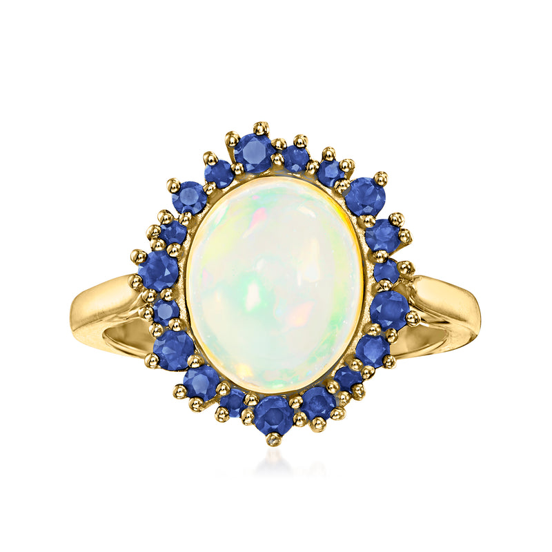 Oval opal center ring with blue sapphire halo and 14kt yellow gold band