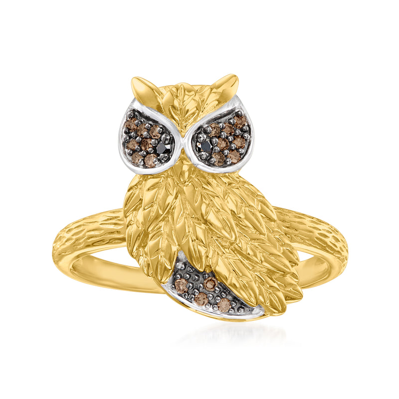Gold-tone owl ring with dark diamond-like stone accents and oval stone eyes