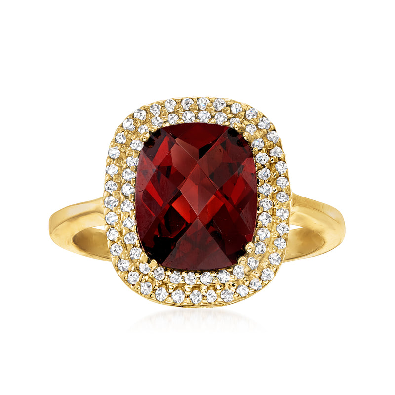 14kt yellow gold garnet halo ring with oval garnet and diamond border