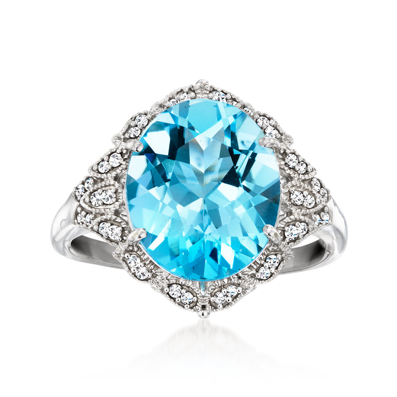 Sky blue topaz cushion ring with diamond halo and side clusters, 14kt white gold setting
