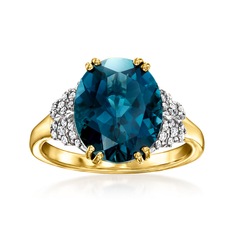 14kt yellow gold ring with large oval blue topaz center and diamond side clusters