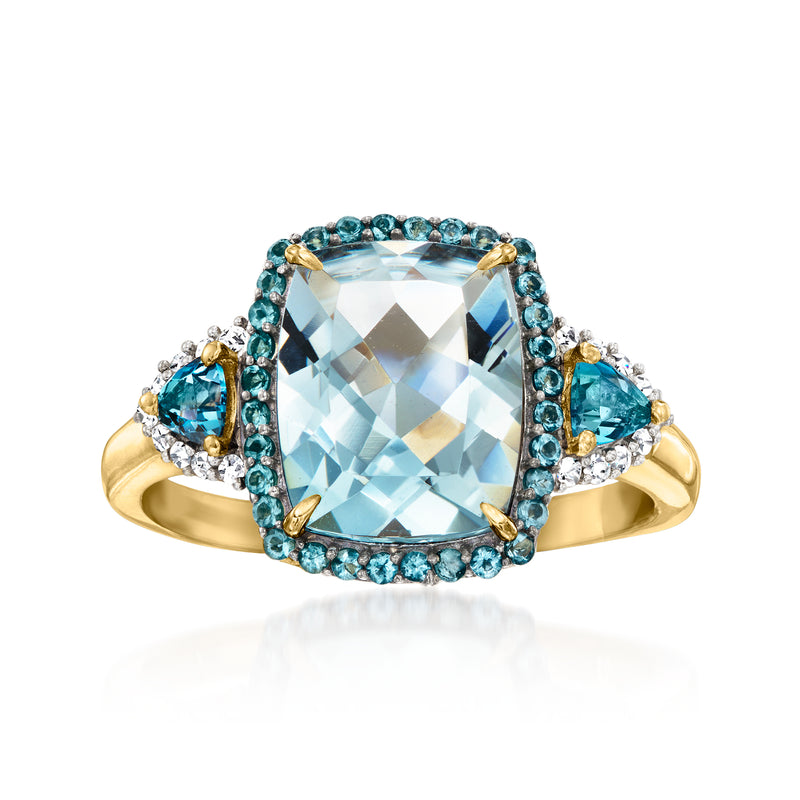 18k gold-tone ring with cushion aquamarine center, blue gemstone halo and diamond accents