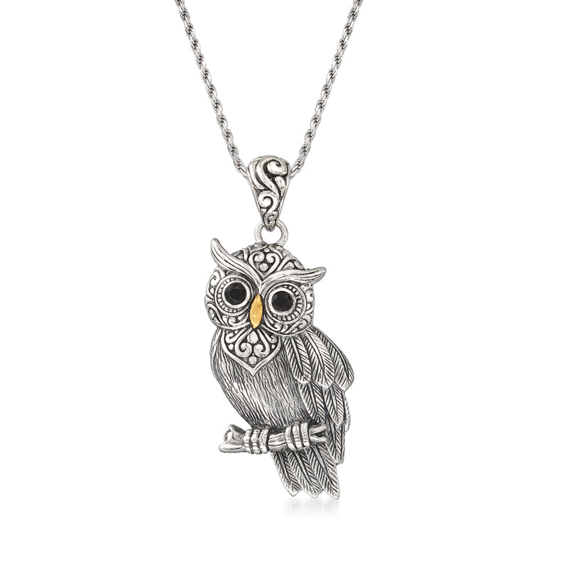 Owl pendant necklace in silver with black onyx eyes and detailed feather design.