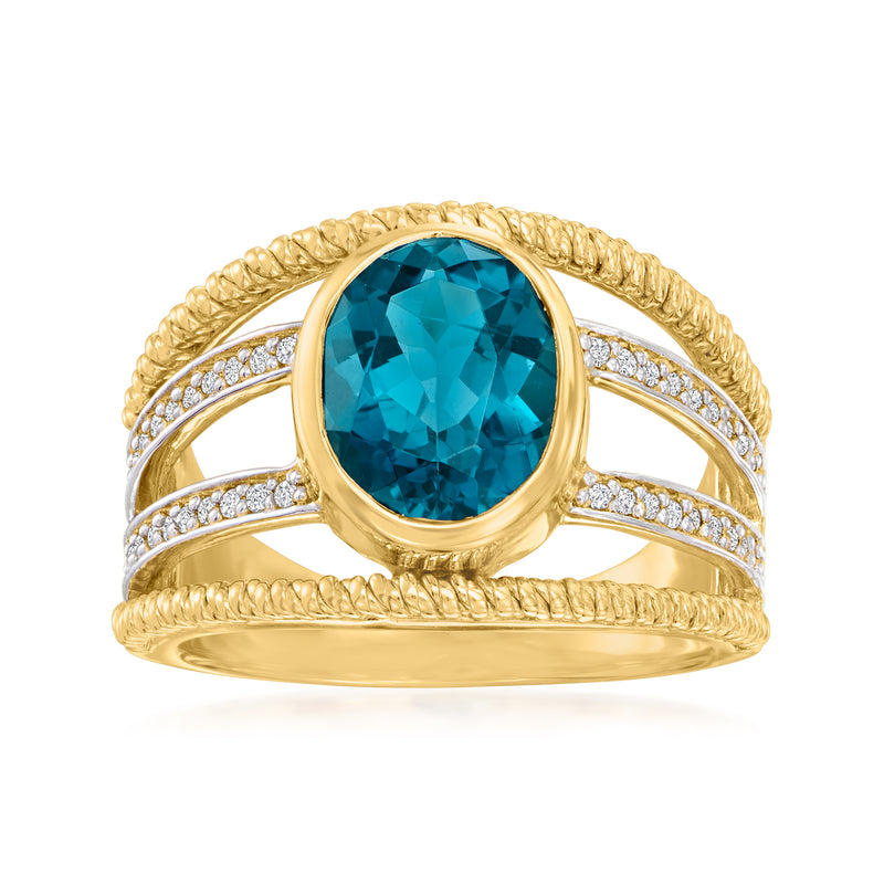 Gold ring with oval London blue topaz center and diamond accents, beaded halo