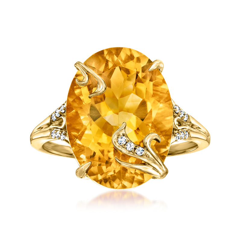 Gold citrine gemstone ring with large oval center and small diamond accents on band