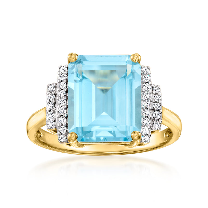 14kt yellow gold ring with sky blue topaz center, diamond side accents