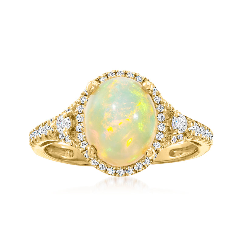 14kt yellow gold ring with oval Ethiopian opal center, diamond halo, and pavé shoulders