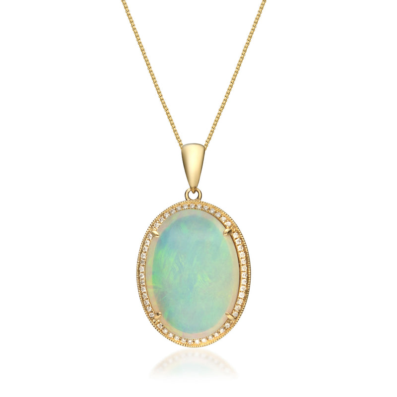 Opal pendant necklace in 14kt yellow gold with oval opal and diamond halo