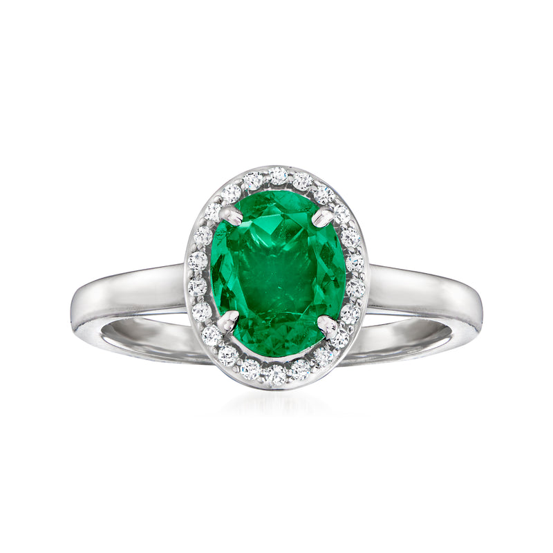 14kt white gold ring with green oval center stone and diamond halo