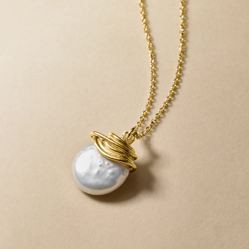 Single coin pearl pendant on 18kt gold over sterling chain with sculpted gold ring