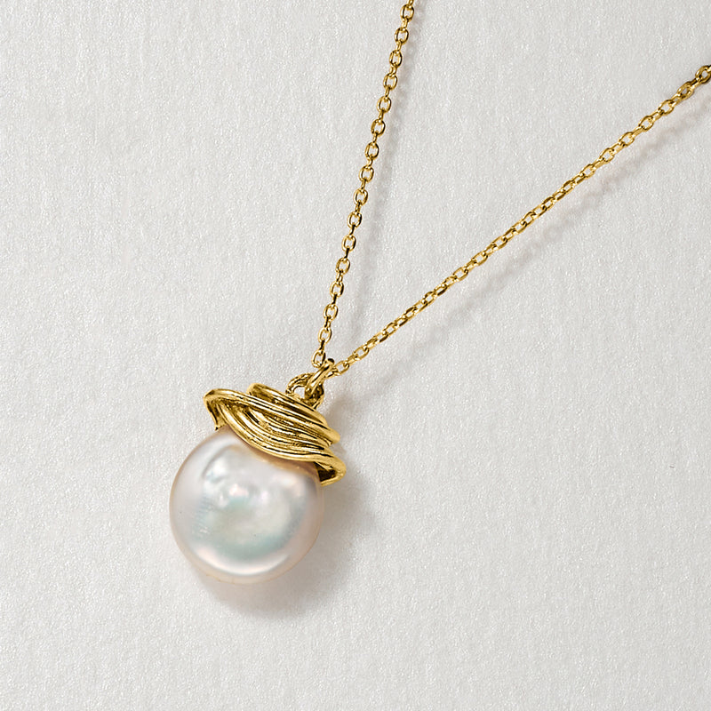 Coin pearl necklace detail with 18kt gold over sterling chain and layered gold bail
